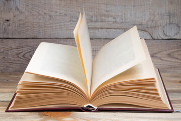 Open book, hardback books on wooden table. wooden background. Back to school. Education. Copy space for text.
