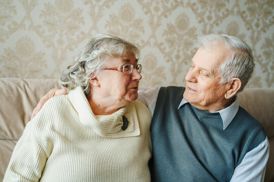 Elderly senior romantic love couple. Old retired man woman together. Aged husband wife in cozy home sweater.Elder hugging kissing people pensioner.Happy family longevity.Tender feelings relationships