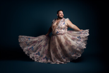 LGBT, chubby man with short-haired, Wearing a long and flowing lace dress with confidence - obrazy, fototapety, plakaty