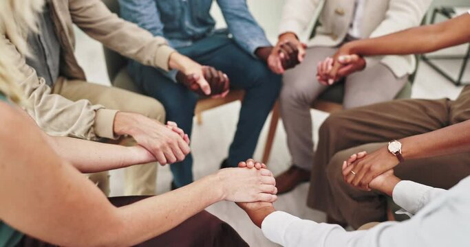 People, holding hands and together at group therapy with support, above or kindness for mental health. Huddle, scrum and empathy with compassion, help and psychology with trust, circle or community