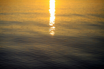 background with sun rays on the water