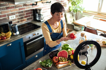 Food Blogger Recording Cooking Vlog in Kitchen