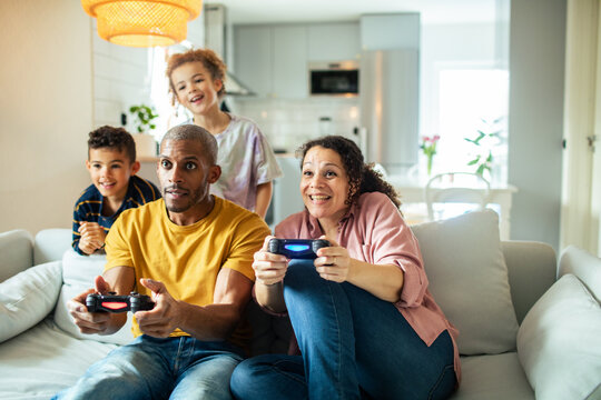 Family enjoying video games together in the living room
