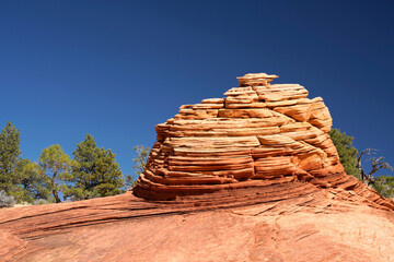 Colorful sandstone formations of the White Domes in the Canaan Mountains and clear blue sky near...