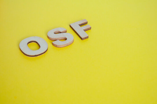 OSF wooden letters representing Open Science Framework on yellow background