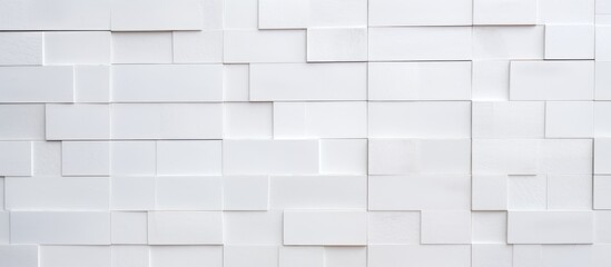 The image features a white wall adorned with numerous square ceramic mosaic cubes, creating a modern and stylish decorative element. The squares add texture and depth to the otherwise plain wall