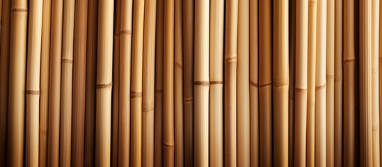 Naklejka premium Detailed close-up view of a bamboo wall showing the intricate pattern and texture of the bamboo material.
