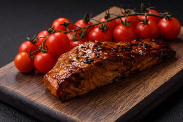 Delicious red salmon fish grilled with sauce and sesame, spices and herbs