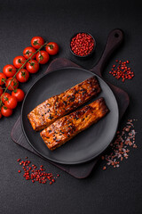 Delicious red salmon fish grilled with sauce and sesame, spices and herbs