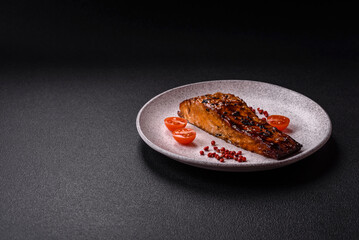 Delicious red salmon fish grilled with sauce and sesame, spices and herbs