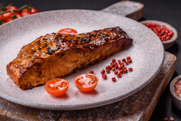 Delicious red salmon fish grilled with sauce and sesame, spices and herbs