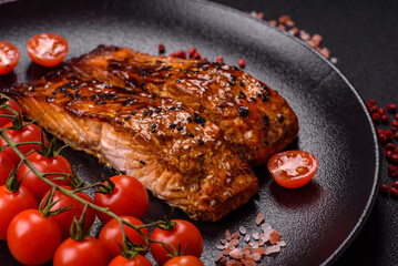 Delicious red salmon fish grilled with sauce and sesame, spices and herbs