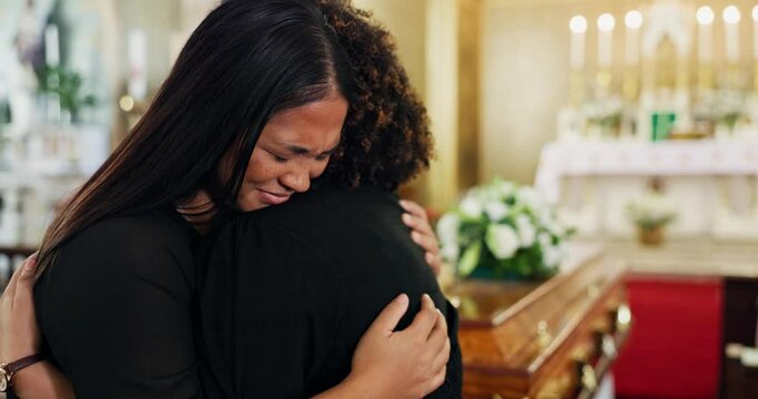 Church, family and cry at funeral with hug for mourning or grief, depression and support for death or mental health. People, together and ceremony or memorial for loss with comfort and unhappy sorrow
