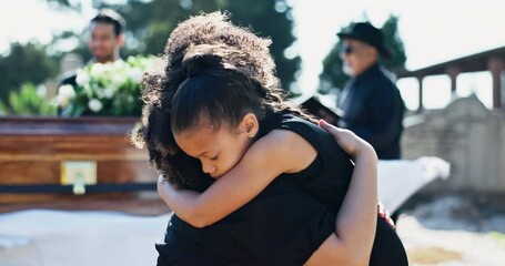 Child, hug or mother in graveyard for funeral. healing or burial for respect, farewell or death with coffin. Girl, depressed or sad kid in cemetery for grief, loss or mourning with mom for support