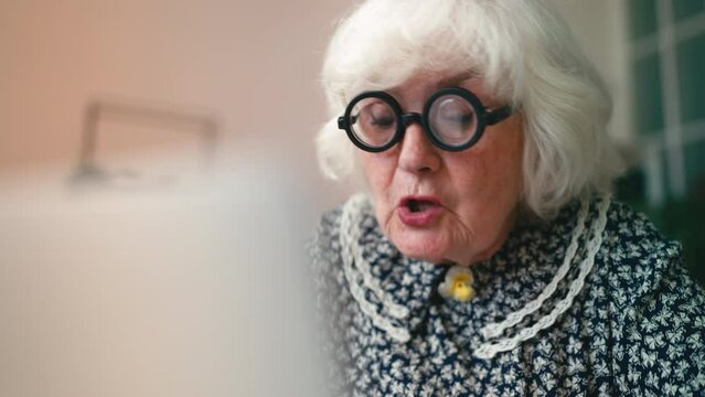 Comic old woman in glasses writing complaint letters to municipal service line