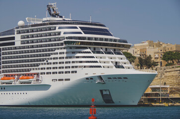 Mega modern huge cruiseship cruise ship liner Grandiosa in port of Valletta, Malta on sunny summer...