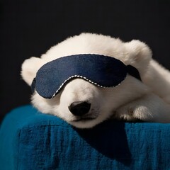 cute baby polar bear cub napping with dark blue sleep mask