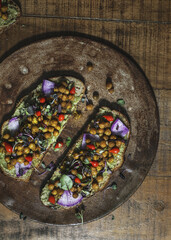 Obraz na płótnie Canvas Homemade organic chickpea toast on a wooden plate