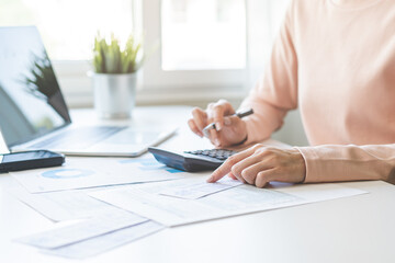 Deduction planning, debt asian young woman  hand using calculator to calculating  money balance...