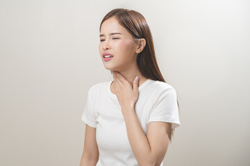 Sickness in inflaming asian young woman, girl use hand check self touch at sore throat, pain...