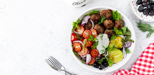 Greek meatballs with tzatziki sauce.