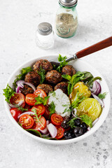 Greek meatballs with tzatziki sauce.