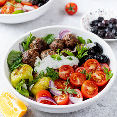 Greek meatballs with tzatziki sauce.