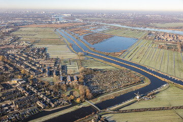 Aerial view Dutch river Lek with view at village Papendrecht