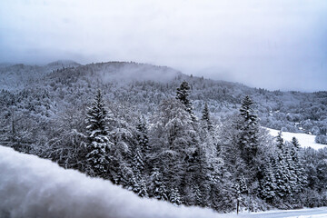 A snow view of the Poprad Landscape Park in Beskid Sadecki on the Poprad River .