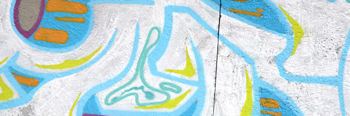 Colorful background of graffiti painting artwork with bright aerosol outlines on wall. Old school...