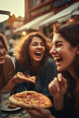 Group of women enjoying pizza at a table. Perfect for food and friendship concepts