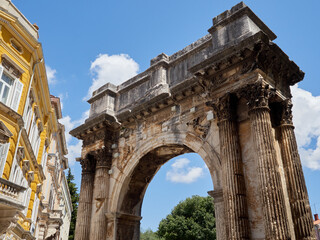Obraz premium Arch of the Sergii. The Arch of the Sergi is a stone ancient Roman triumphal arch in Pula, Istria, Croatia, Europe