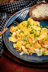 Scrambled eggs with onion and chives.