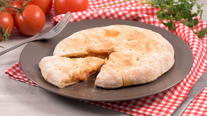 Pizza calzone on wooden background