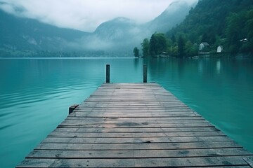 A peaceful dock on a serene lake with majestic mountains in the background. Suitable for travel and nature concepts