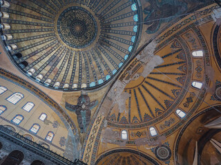 Fototapeta na wymiar central dome of Hagia Sophia converted into a mosque, painting ceilings and vault in Santa Sofia, orange and blue , Istanbul, Turkey