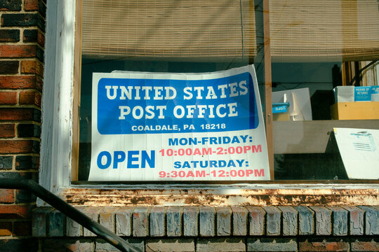 Sign in a window of the Post Office in Coaldale, Pennsylvania