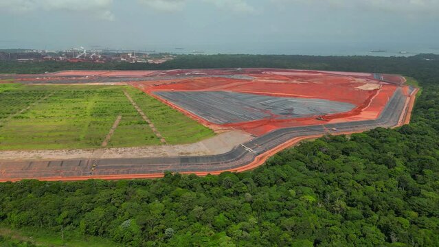 Aerial drone view of waste depot undergoing closure with natural cover of an alumina refinery in Barcarena, PA, Brazil.