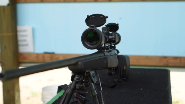 Slow motion shot of rifle on a table tripod at a gun range