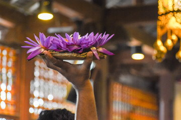 Flower vases that devotees take to worship Tooth Relic at Temple of the Tooth (Sri Dalada Maligawa), Kandy, Sri Lanka.