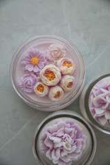 Candles in the form of colorful flowers