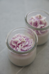 Candles in the form of colorful flowers