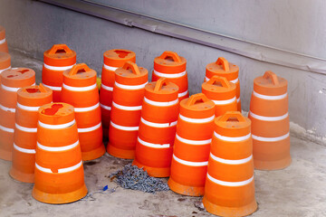Several orange-colored bounding cones stand