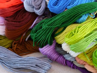 A Pile of different colour embroidery threads.