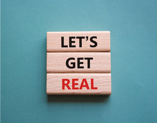 Lets get real symbol. Concept words Lets get real on wooden blocks. Beautiful grey green...
