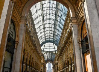 Low-angle view of Galleria Vittorio Emanuele II (1877), the Italy's oldest active shopping gallery in the city centre of Milan, Lombardy, Italy