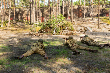 Reconstruction of battle from the Second World War. American paratrooper soldiers during combat in...