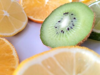 Sliced fruits – kiwi, orange and lemon.
