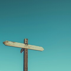 Blank Wooden Directional Sign Against Blue Sky