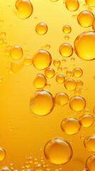 Abstract yellow bubbles floating in a yellow liquid.